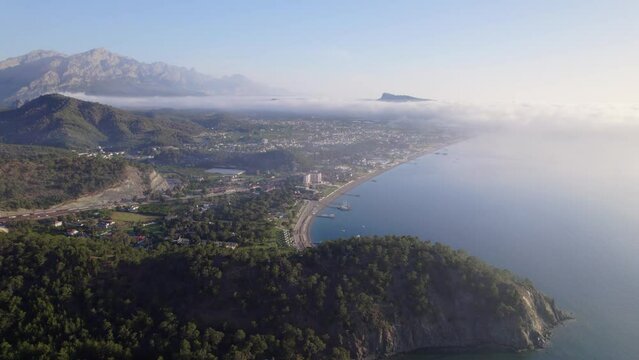 Antalya Kemer Phaselis cape bays blue sea and land forest area foggy blue sky