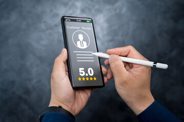 Businessman using smartphone give rating to service experience on online application.