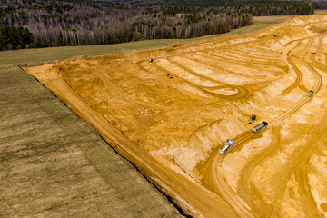 Top view of the edge of an active sand quarry, extraction of construction sand
