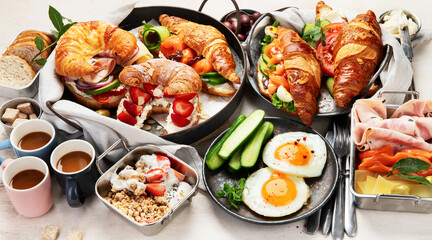 Large selection of breakfast food on a table.