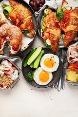 Large selection of breakfast food on a table.