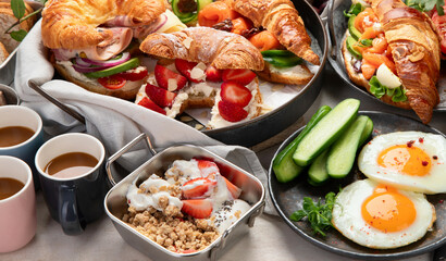 Large selection of breakfast food on a table.