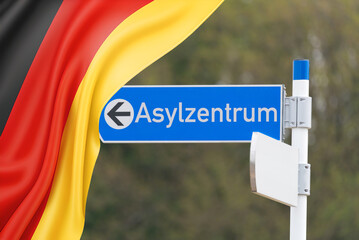 Flagge von Deutschland und Schild Asylzentrum
