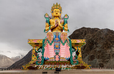 Large colorful Buddhist statue at the Diskit Monastery in the Nubra Valley in northern India