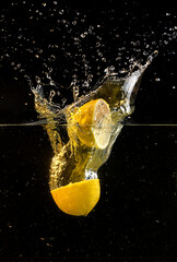 lemon splashing into water