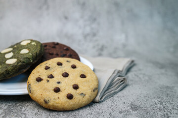 Greentea Cookies, Vanilla Cookies and  Chocolate Cookies on Plate Isolated on Gray Background. Small Business Idea. 
