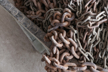 Photo of a pile of old rusty chains, made of steel