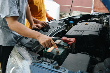 Hand Pointing Into Car Machine, Father Teaching Son How To Repair and Check The Car. 