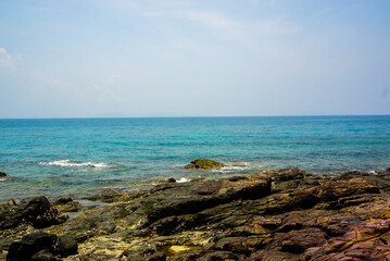 A mesmerizing fusion of natural beauty, rocks, and tranquil coastline