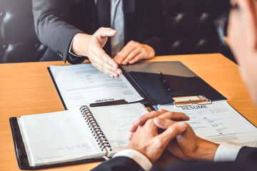 Job interview concept , Senior manager reading a resume during a job interview employee young man meeting Applicant and recruitment