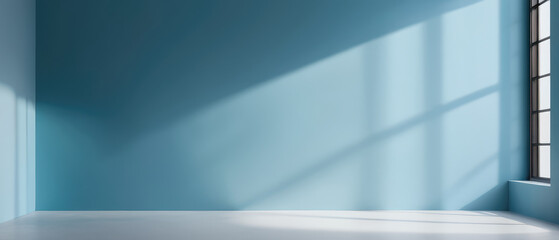 Minimalistic simple abstract light blue background for product presentation. Shadow and light from windows on wall.