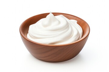 Creamy white whipped topping in a wooden bowl