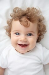 Fototapeta premium Adorable baby with curly hair smiling