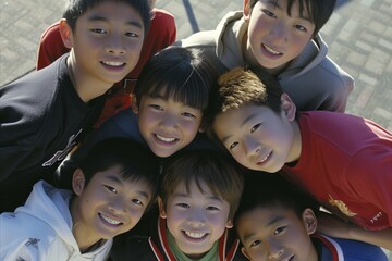 Group of asian children smiling and looking at the camera, top view