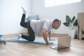 Senior Man Workout at Home By Online Tutorial Instructor 