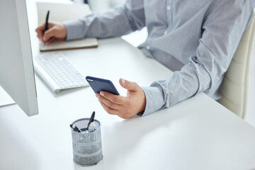 Businessman, hands and cellphone with diary in office for planning or schedule, tasks and agenda...