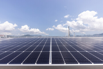 Solar Panels: Solar panels glisten under the clear blue sky, harnessing energy