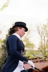 Close-up of dressage rider in traditional attire