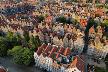 Beautiful panoramic architecture of old town in Gdansk, Poland at sunrise. Aerial view drone pov....