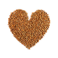 Caraway brown curved seeds delicately arranged in heart shape Spices food and culinary concept showcasing