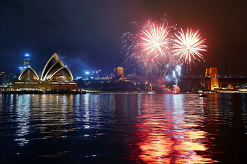 The view of Sydney City with Opera house and fireworks and cruise in celebrating festival at Sydney