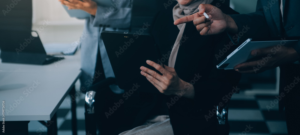 Wall mural shot of an attractive mature businesswoman working on laptop in her workstation.