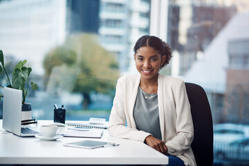 Desk, laptop and portrait of business woman in office, working on online project, planning and...