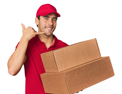 Young Hispanic delivery man with boxes showing a mobile phone call gesture with fingers.
