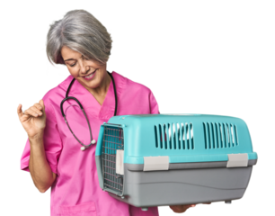 Middle-aged Caucasian female vet holding a carrier