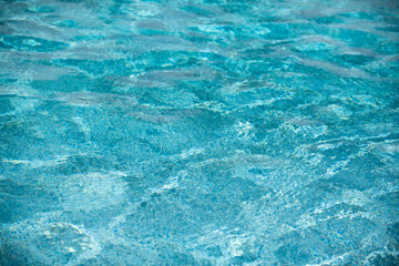 Tansparent clear calm water surface texture. Abstract nature background. Sea water pattern.