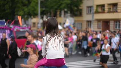 Little kid sit father shoulder. Gay protest against no homophobia. Family walk lgbt pride parade....