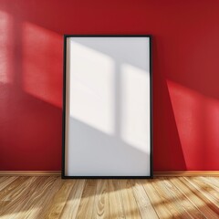 Dynamic Contrast: Empty Poster Frame Against Red Wall on Wood Floor