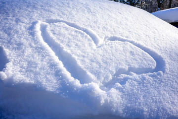 Obraz premium Hand-drawn Heart Shape in Fresh Snow, Symbol of Love in Winter Setting