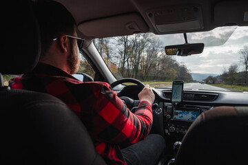 road trip concept man driving car by highway inside view