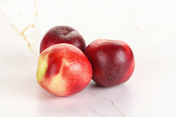 Ripe sweet juicy nectarines heap