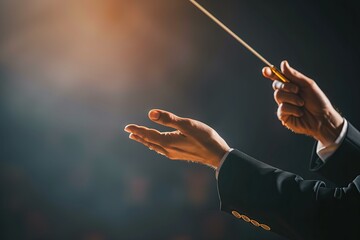 Gesture. Bandmaster. Orchestra conductor's hands holding the baton. Musical performance at concert hall, blurred background. Copy space. Theater. Maestro. Director. Leader. Wand. Choir conductor