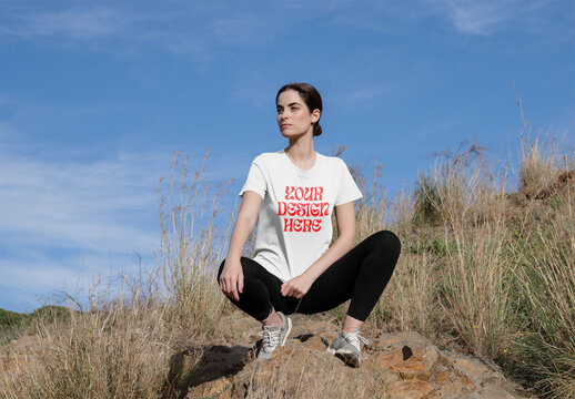 Mockup of woman wearing customizable sports t-shirt, crouching
