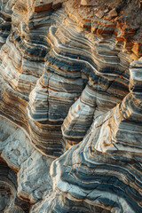 Close up of layered patterns and textures of sedimentary rock formations, with each distinct layer representing a different geological epoch .