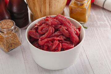 Raw beef meat - sliced strips