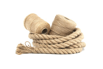 Various rolls of natural jute rope and twine isolated on white