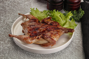 Grilled quail in the plate