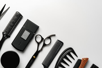 Set of barber tools for haircut on gray background flat lay