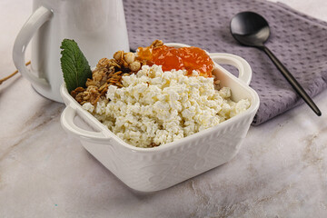 Curd with granola and orange jam