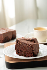 Fresh homemade chocolate sponge cake on wooden board