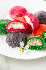 Multi-colored Japanese cakes Mochi in a white plate