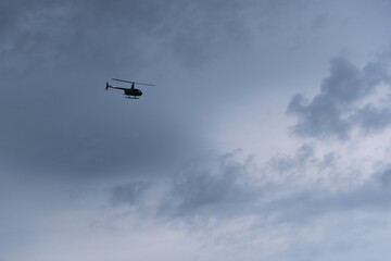 Solo Helicopter in Cloudy Sky