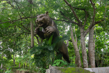 Bronze Tiger Statue in Forest