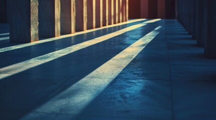 Blue concrete floor with long shadows from the pillars