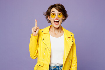 Young smiling woman wears yellow shirt white t-shirt casual clothes glasses holding index finger up...