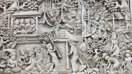 Bali MARCH 2024 - A bas relief Sculpture of Balinese life moments on a wall, Bali, Indonesia